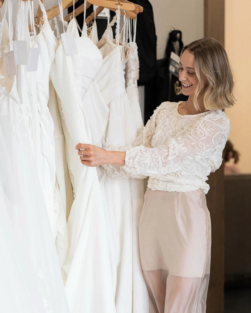 Photo of the model looking at the gown