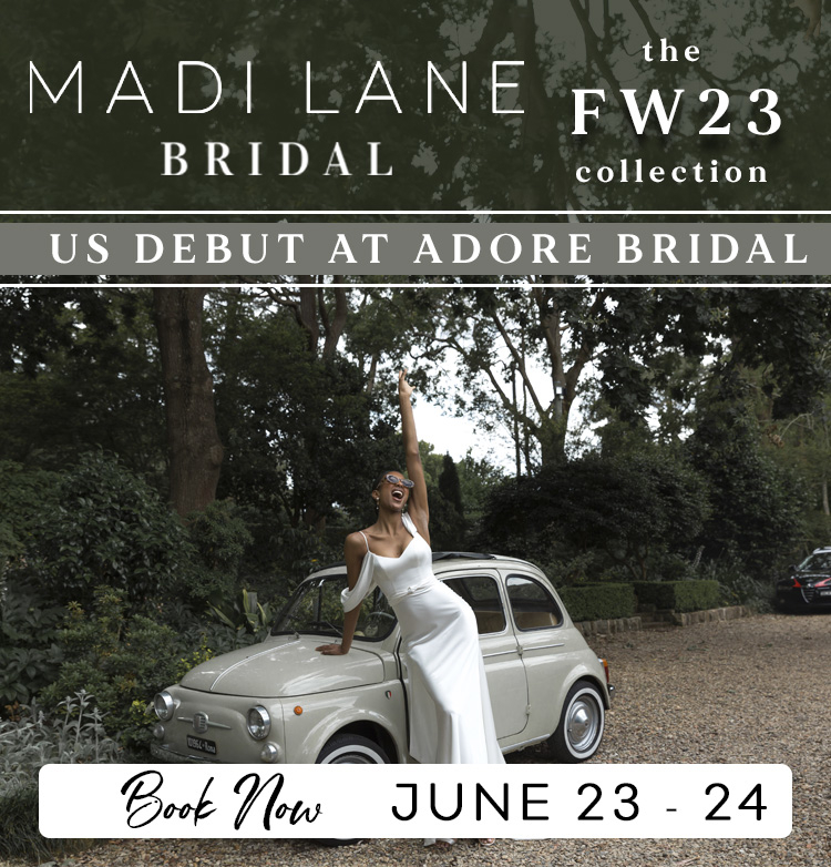 Bride by vintage Italian car in sleek simple wedding gown